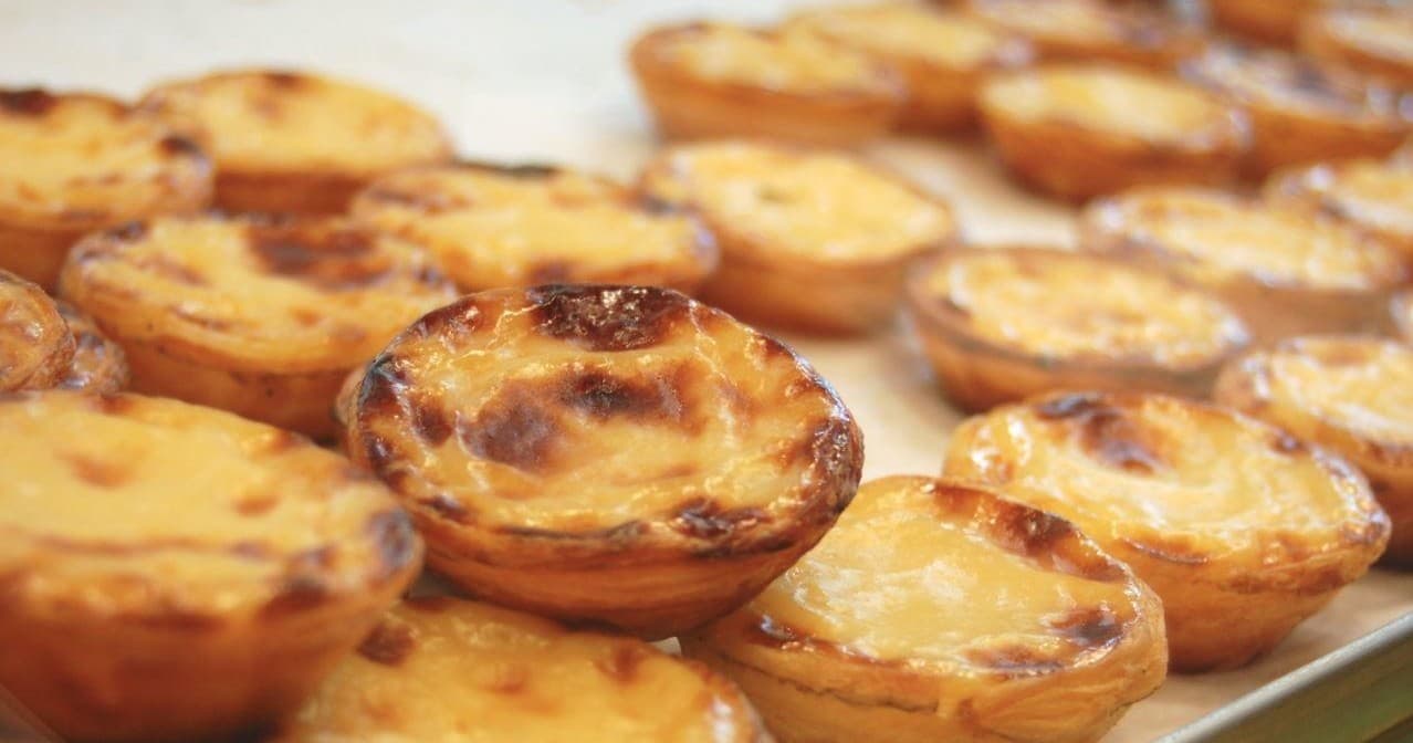 Close-up of pastel de nata pastries in Lisbon bakery tasting tour