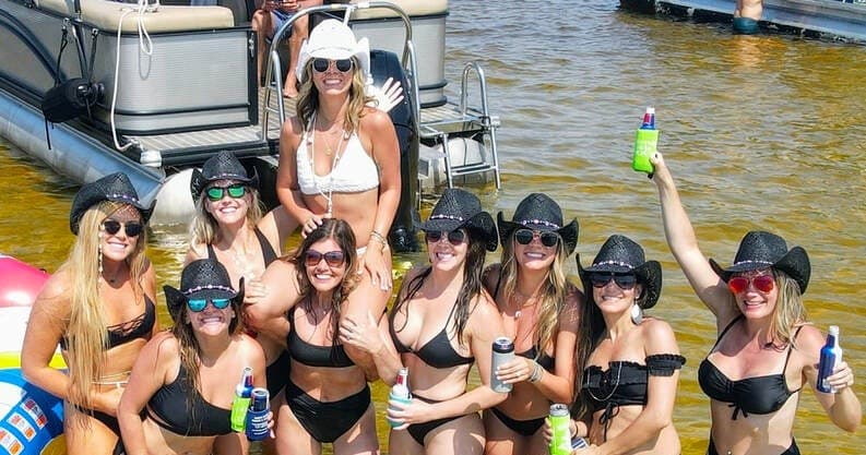 Women partying on pontoon boat in Destin emerald waters