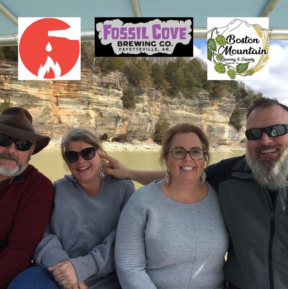 Friends on a scenic riverboat tour past sandstone cliffs