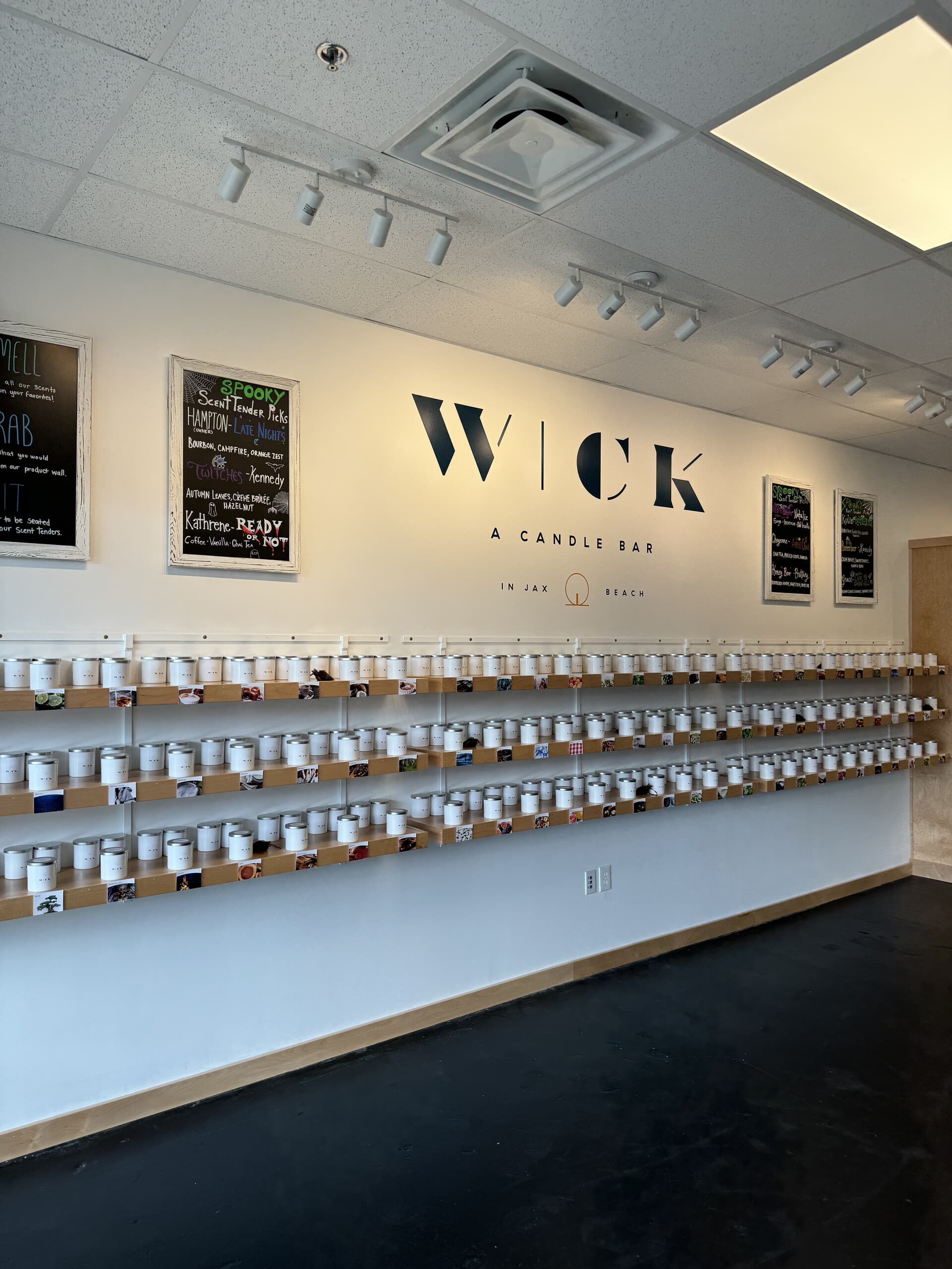 Rows of candle sample tins lining the wall at Wick Jax Beach
