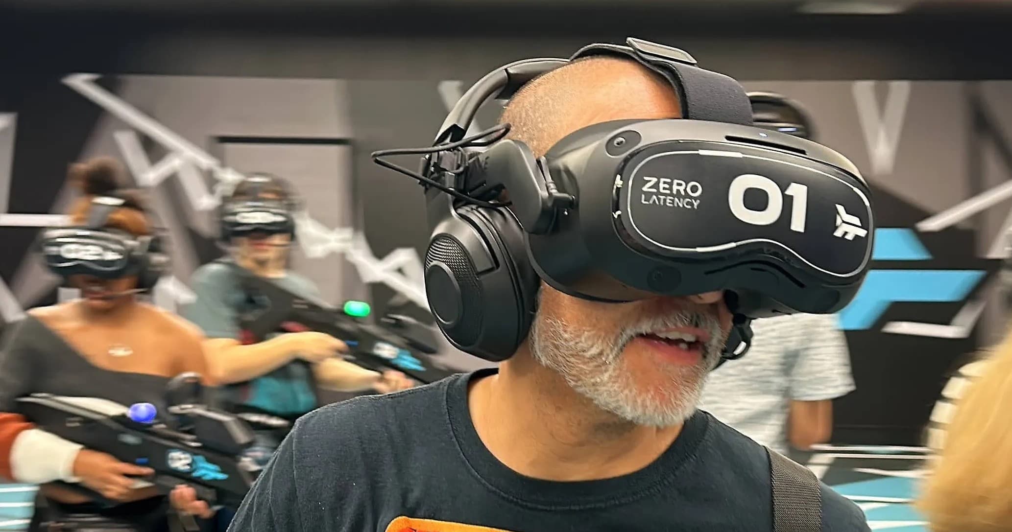 Adult enjoying immersive VR experience at indoor arena