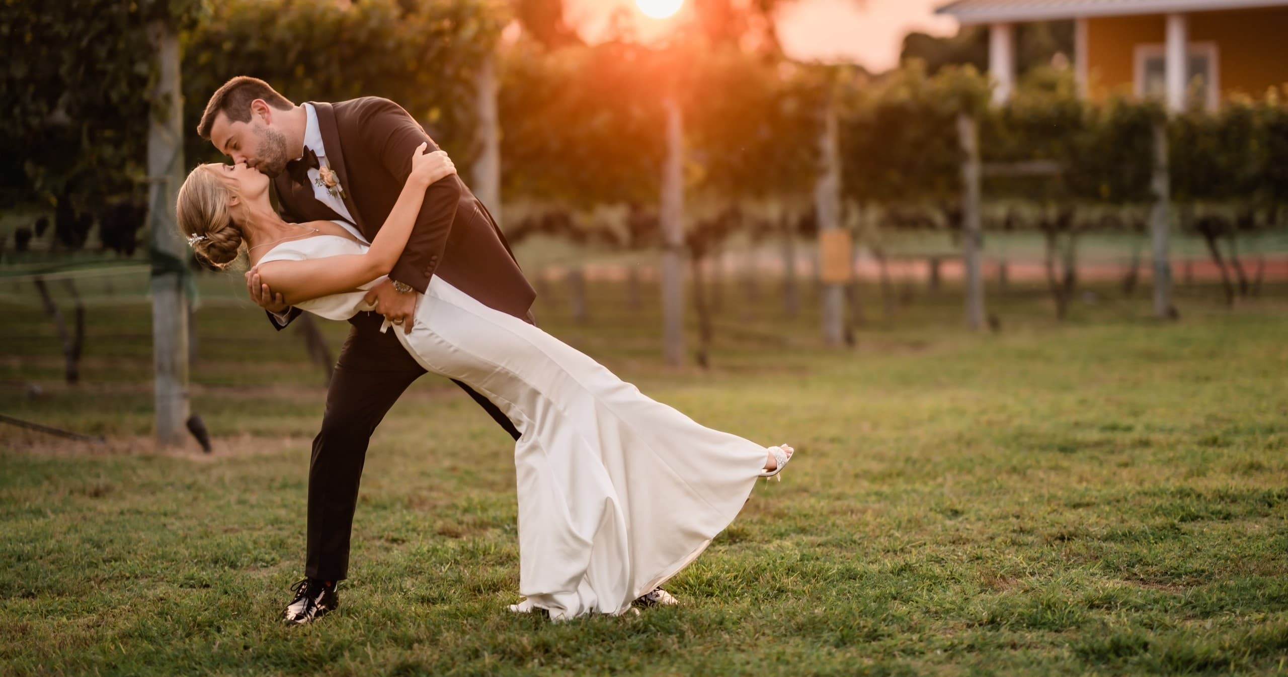 Couple dancing in vineyard at sunset during Cape May winery wedding