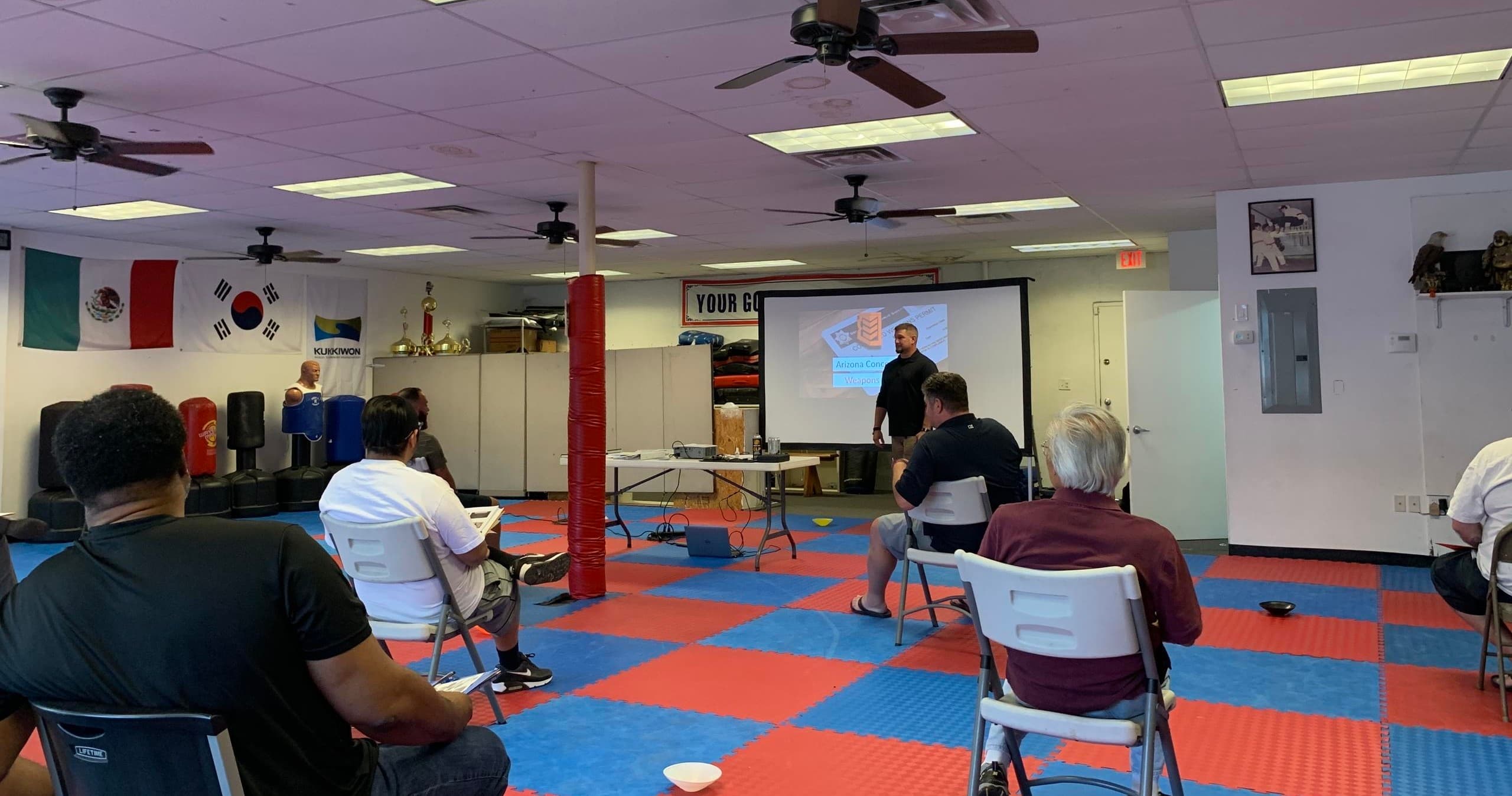 Hands-on defensive tactics workshop in martial arts studio training room