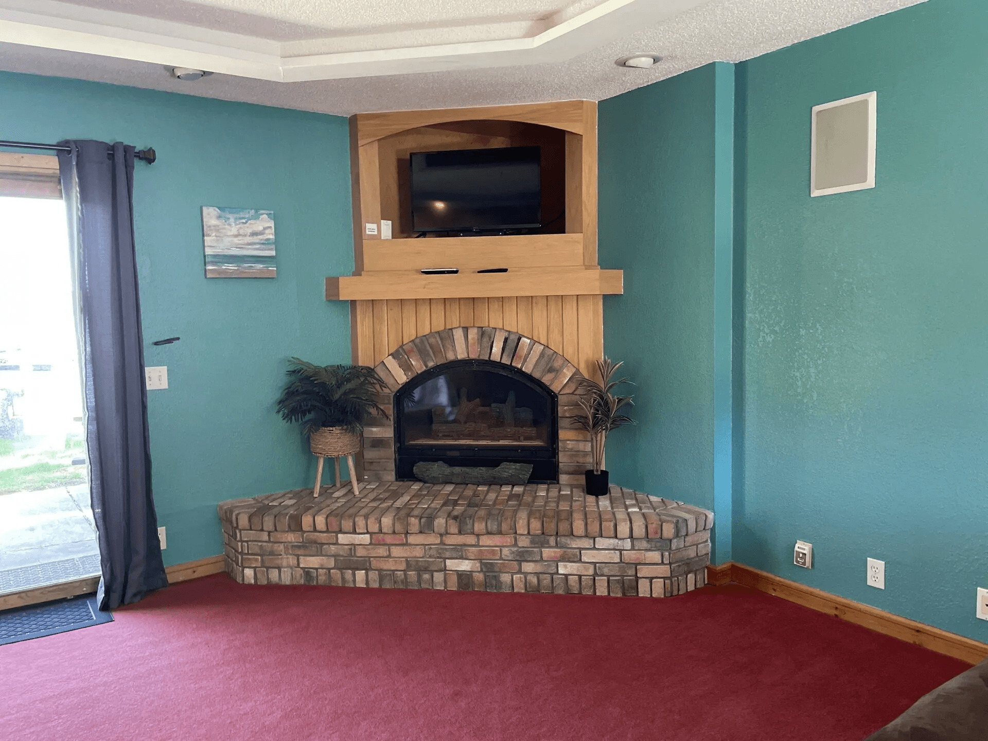 Cozy living room with brick fireplace in cabin retreat
