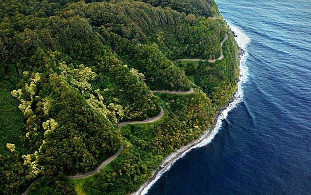 Winding coastal cliff road with ocean views for scenic drives