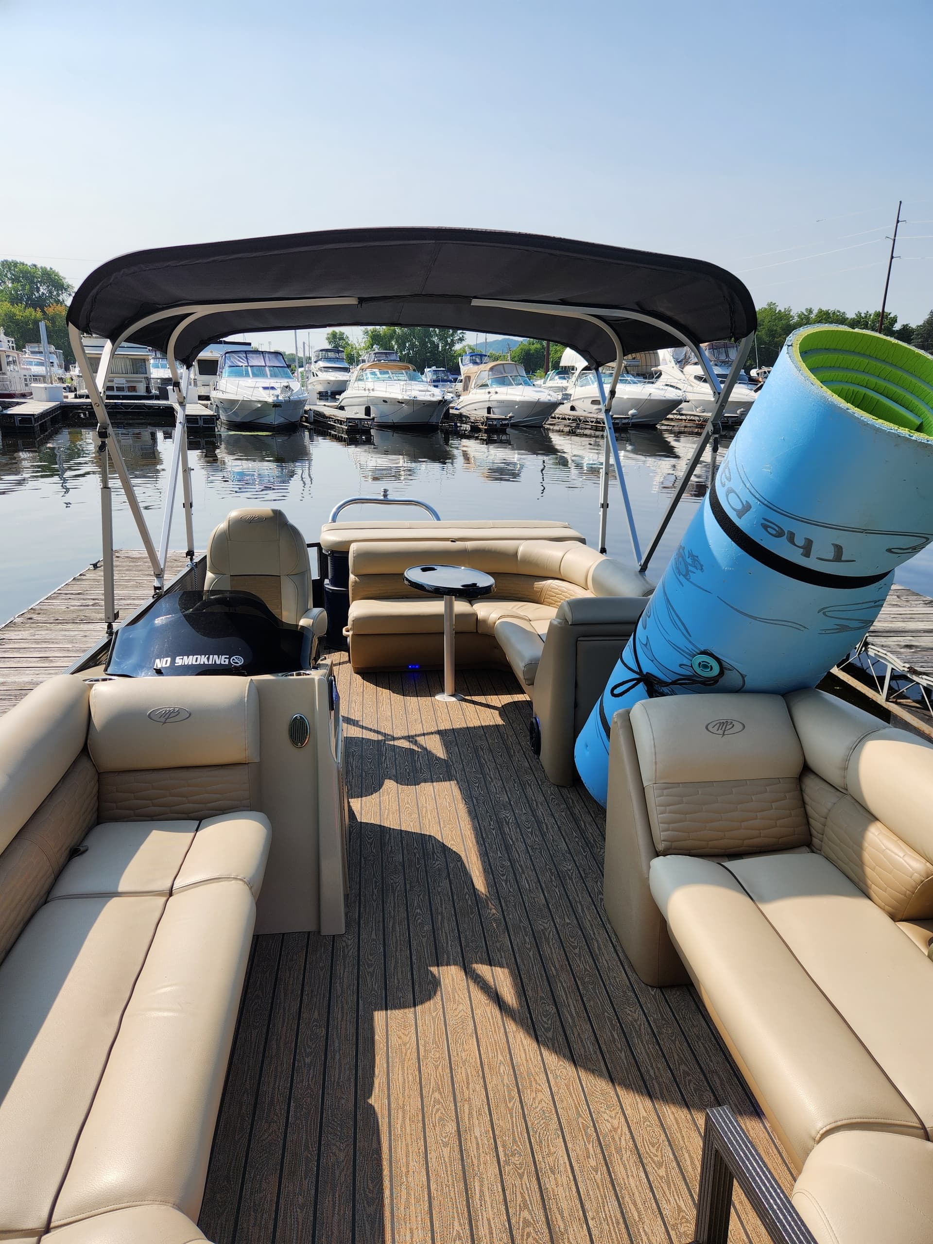 Pontoon interior view with plush seating and wake gear