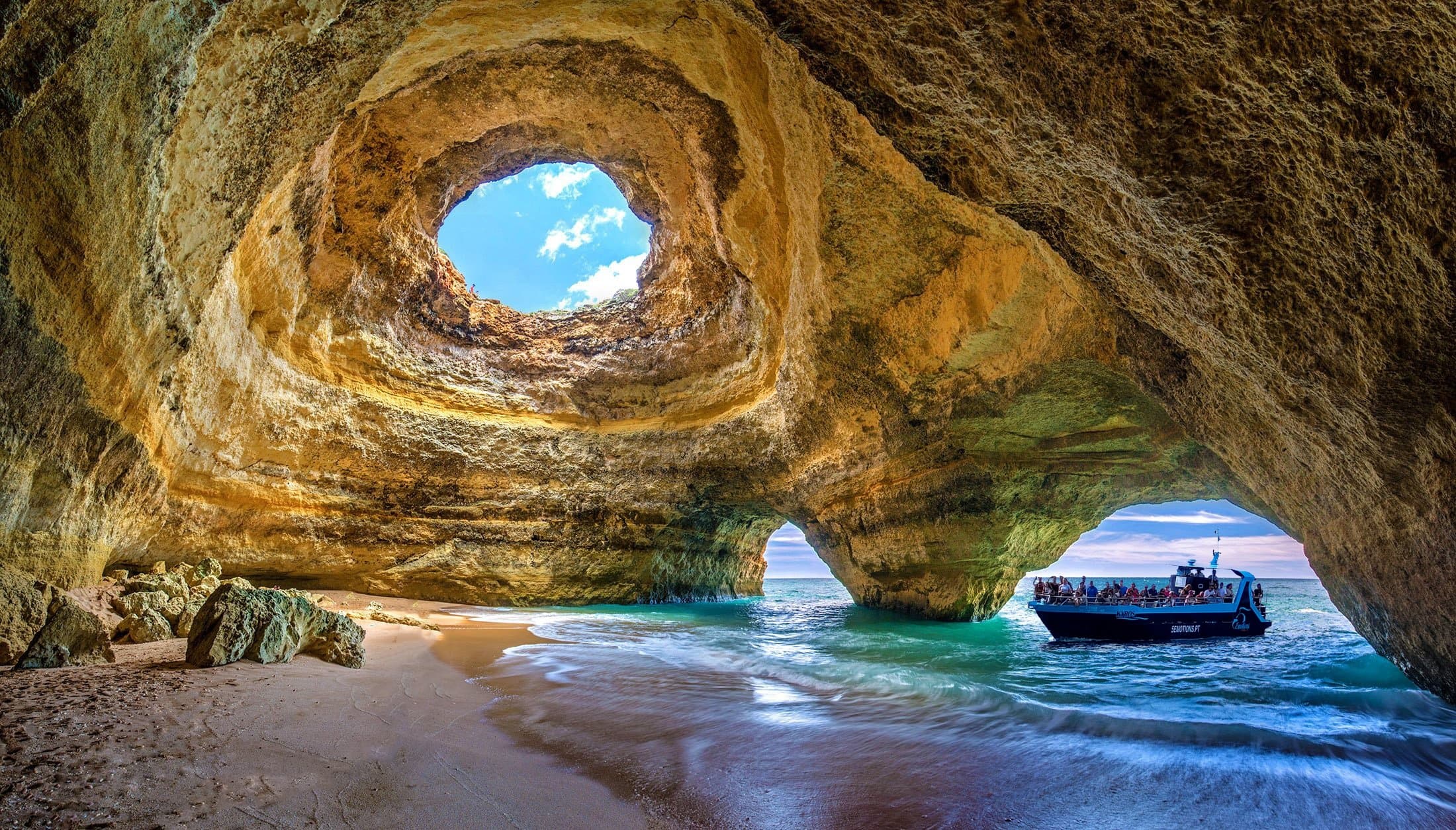Boat entering Benagil sea cave, Algarve coast, Portugal tour