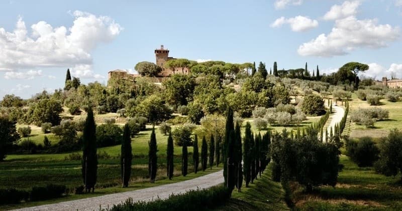 Scenic drive past cypress-lined road to Tuscan hilltop villa