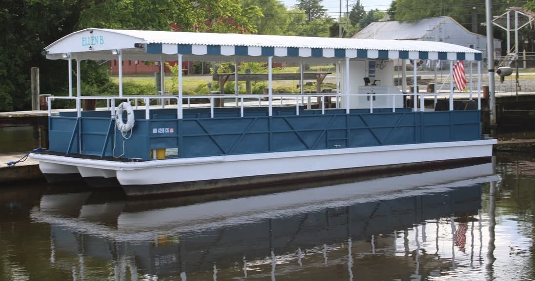 River tour boat docked on calm Choptank River, scenic cruise