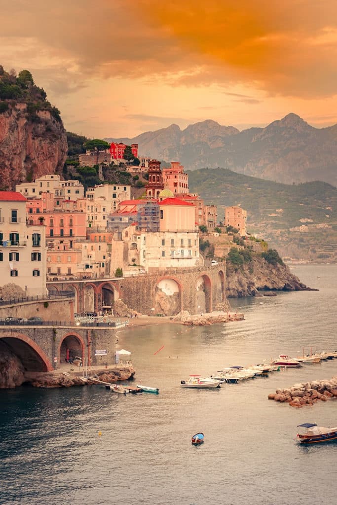 Harborfront village views with small boats at Amalfi Coast