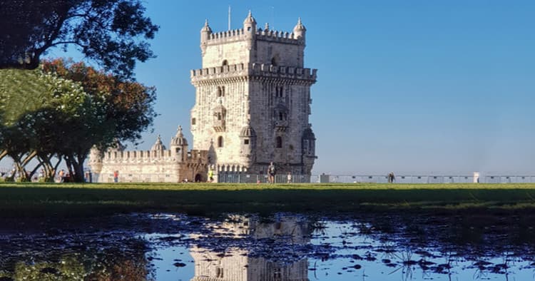 Iconic riverside Belem Tower reflected in Lisbon waters