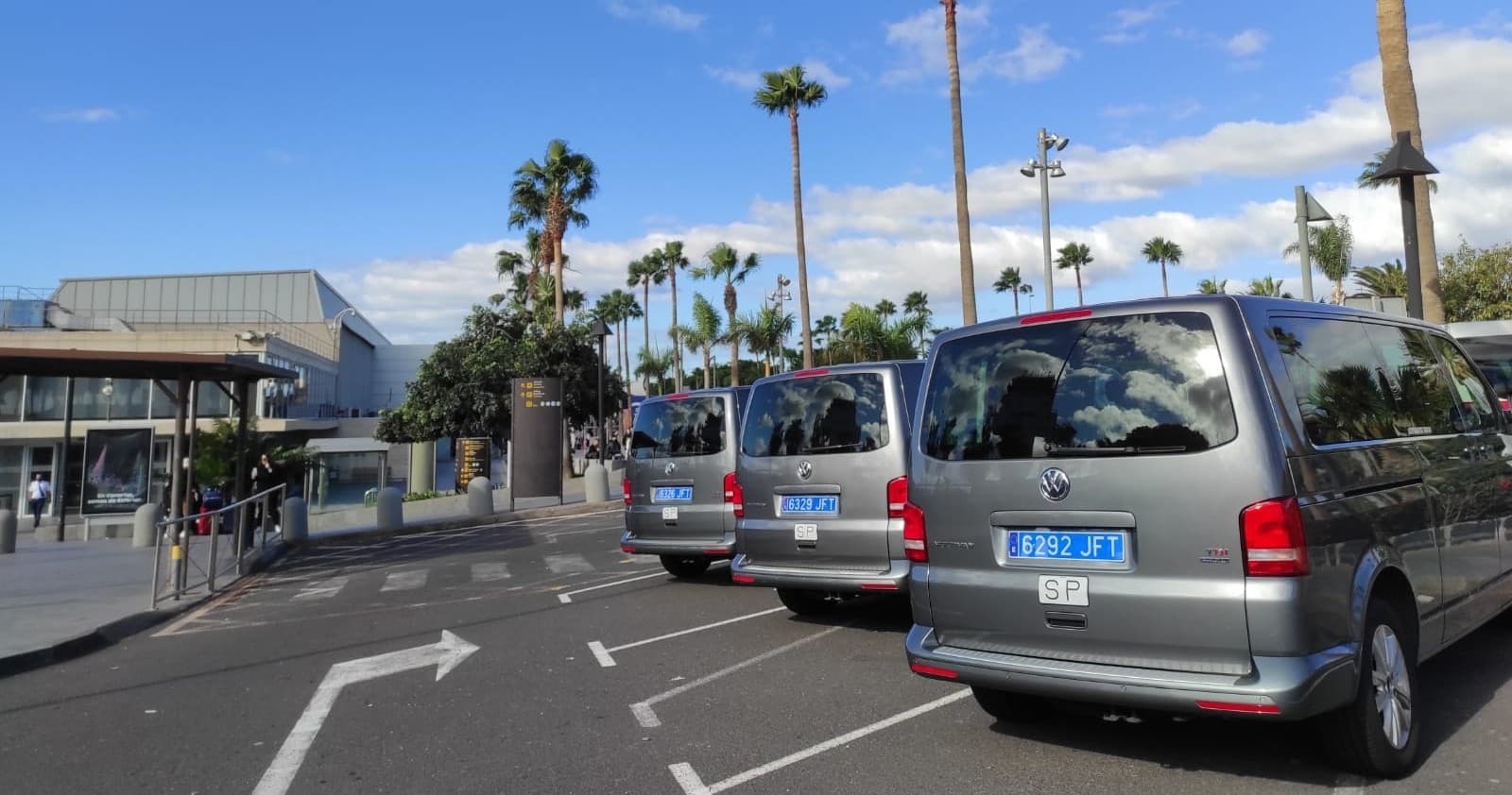 Fleet of airport shuttle vans lined up at Tenerife terminal