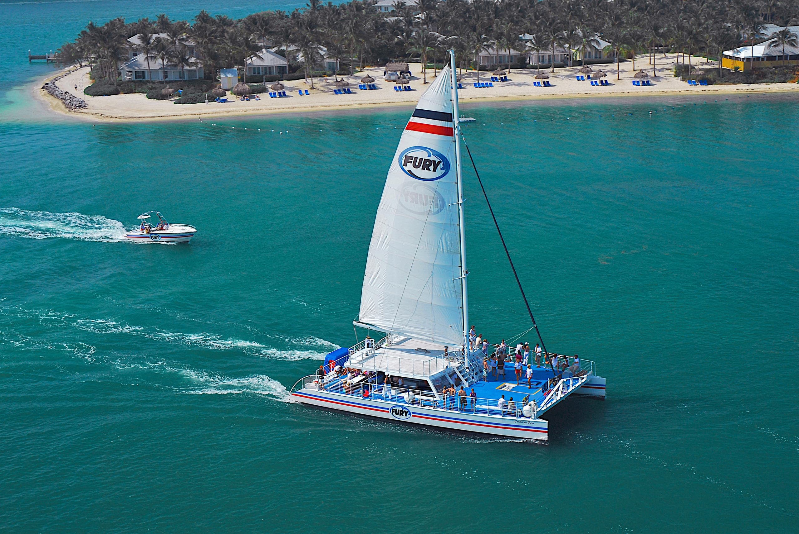Boat cruising over emerald water, expansive ocean vista