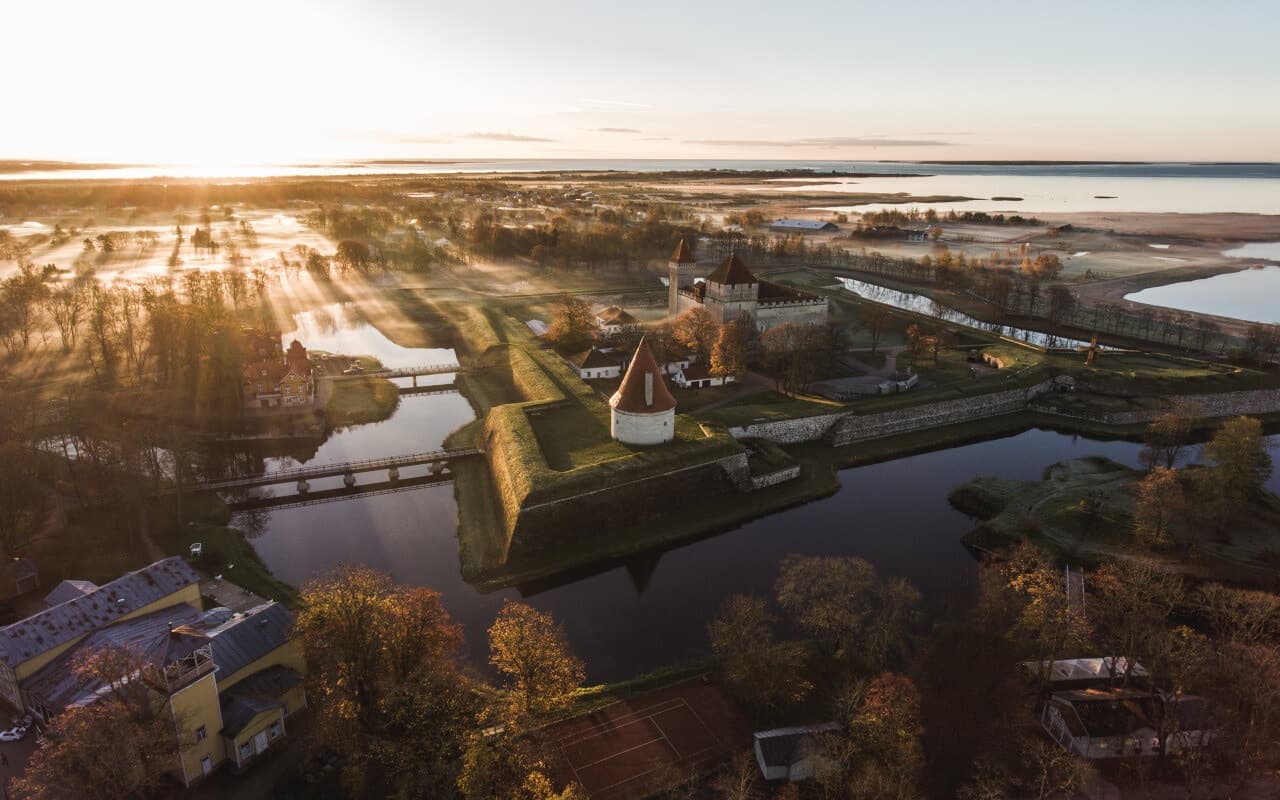 Aerial view of coastal fortress and waterways at sunrise