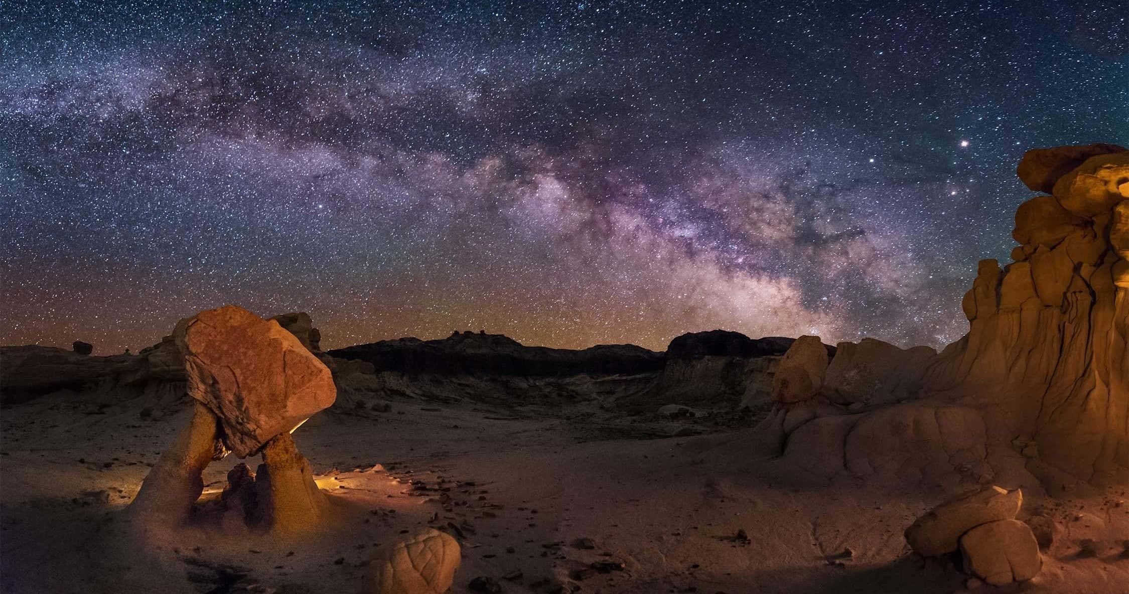 Milky Way over desert hoodoos, nighttime stargazing vista