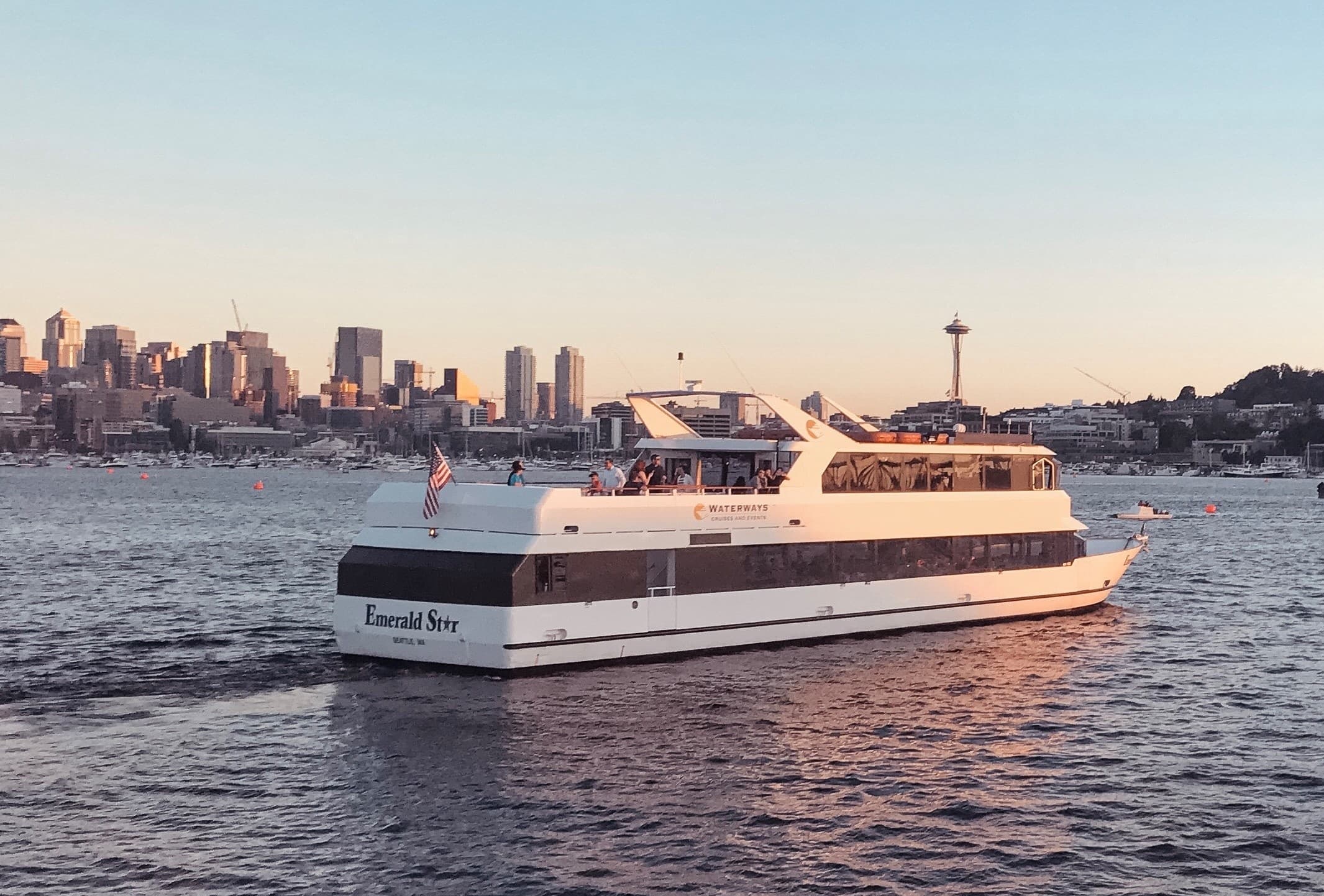 Scenic sightseeing ferry cruising near Seattle waterfront skyline