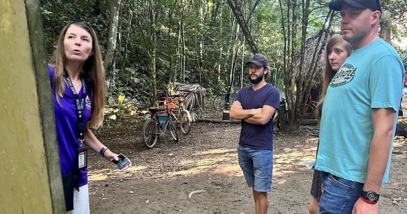 Guided Coba jungle tour with visitors and bikes at ruins site