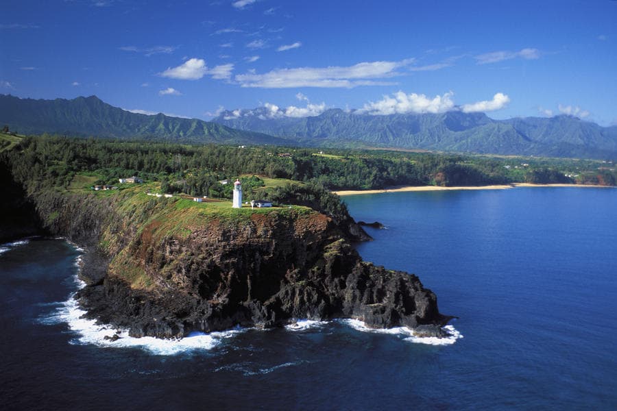 Dramatic seaside cliff and lighthouse view along Kauai coastline
