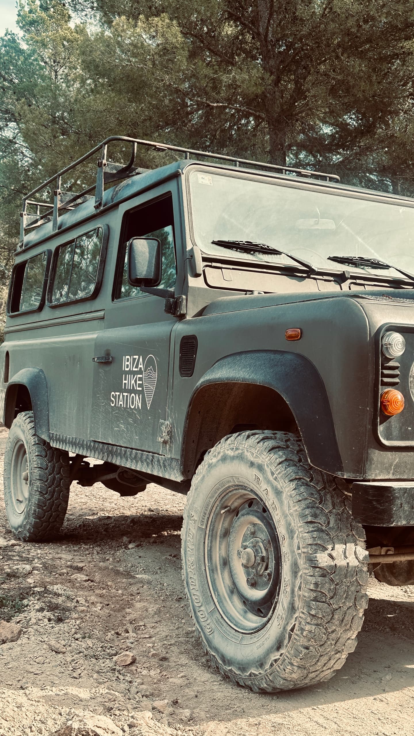 4x4 vehicle parked near Mediterranean coastal trail