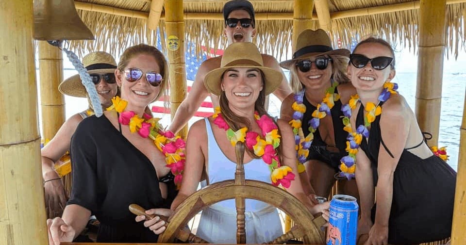 Group enjoying tiki boat cruise and drinks in Islamorada keys