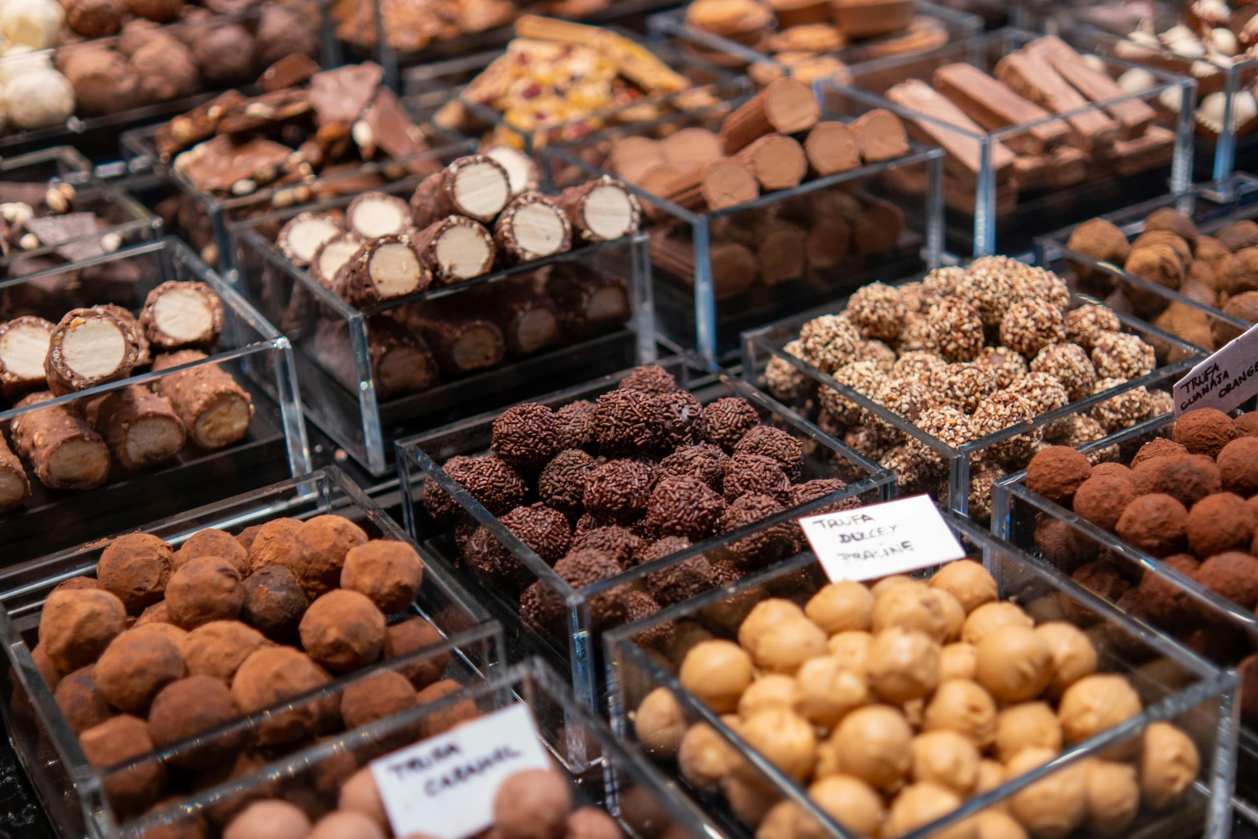 Assorted chocolate truffles at London market stall for tasting