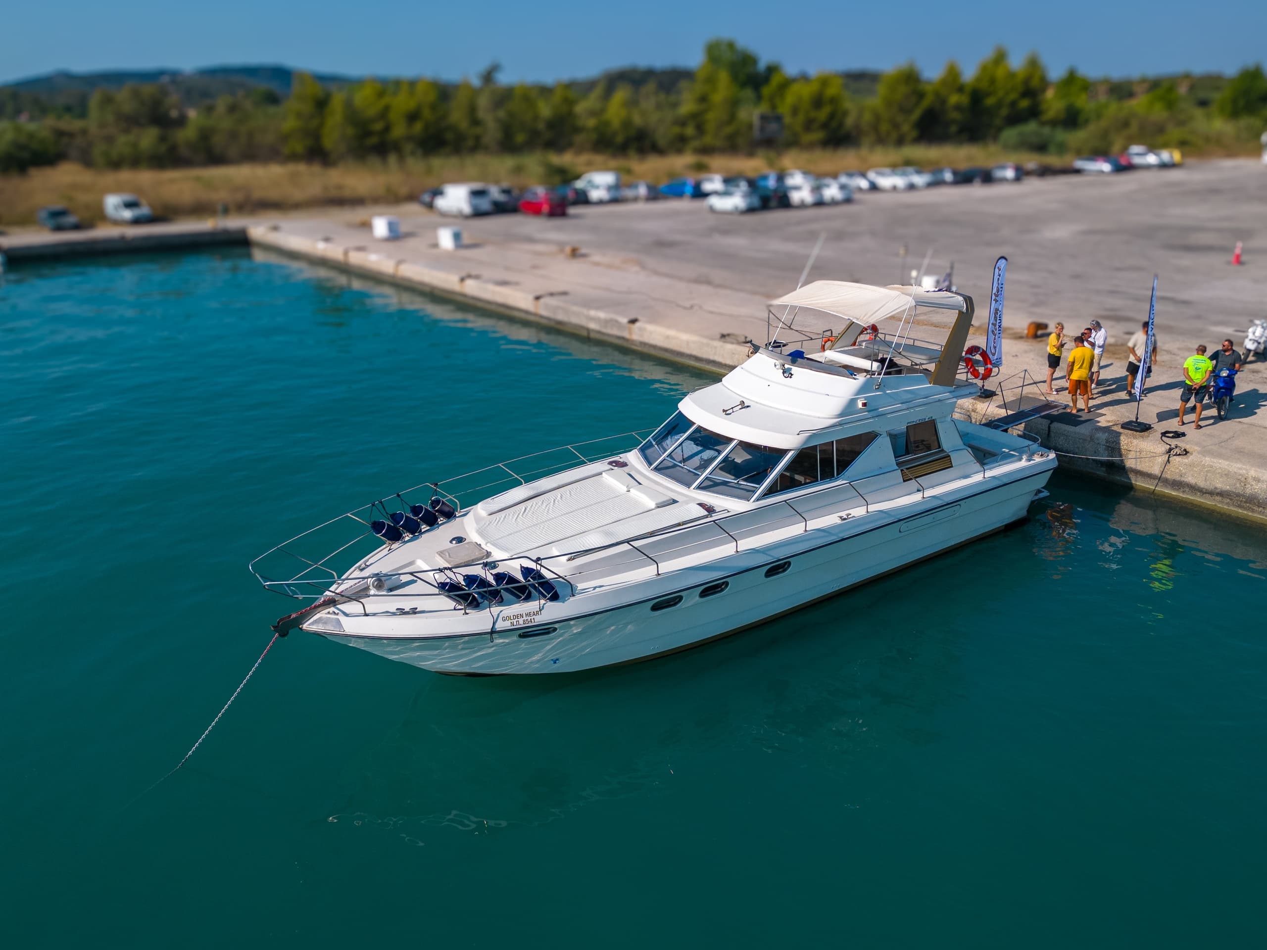 White yacht moored at harbor pier, seaside leisure cruise