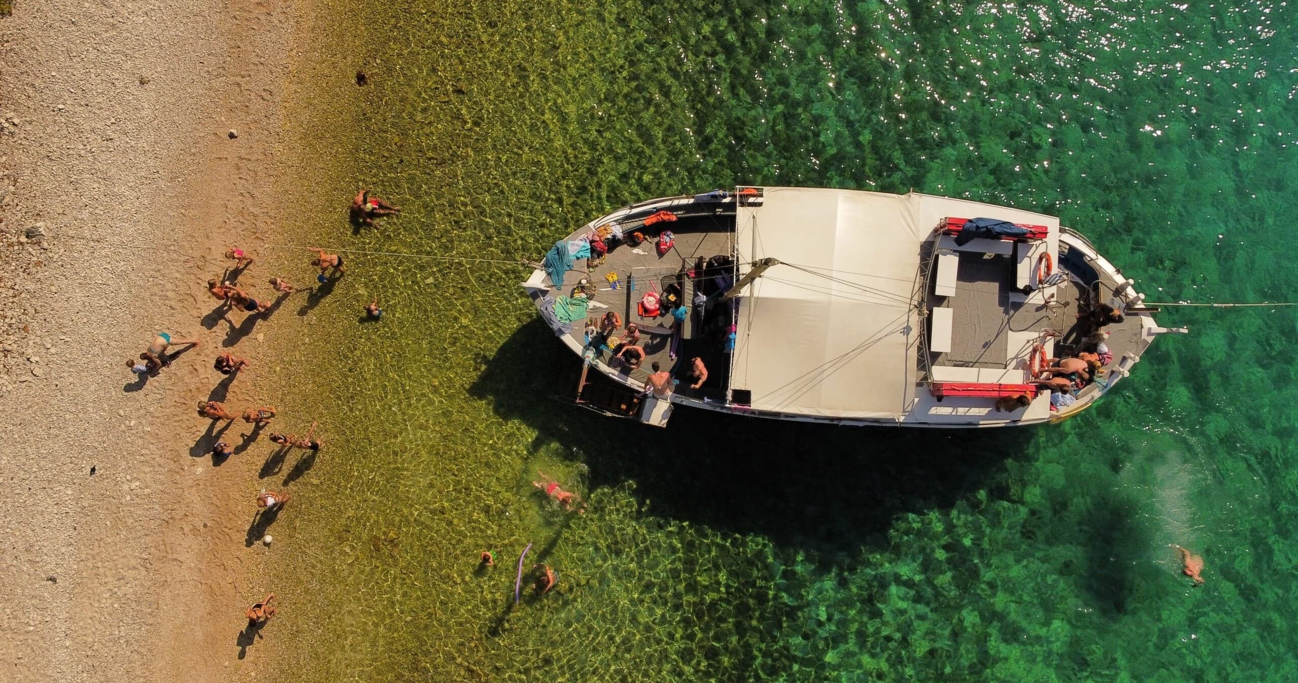 Private Sunset Cruise to Blue Lagoon from Lefkimmi — Swim the Blue Lagoon, Explore Mourtos Cave, Share Pizza on a Kaiki