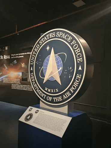 Viewing US Space Force emblem in indoor museum space exhibit