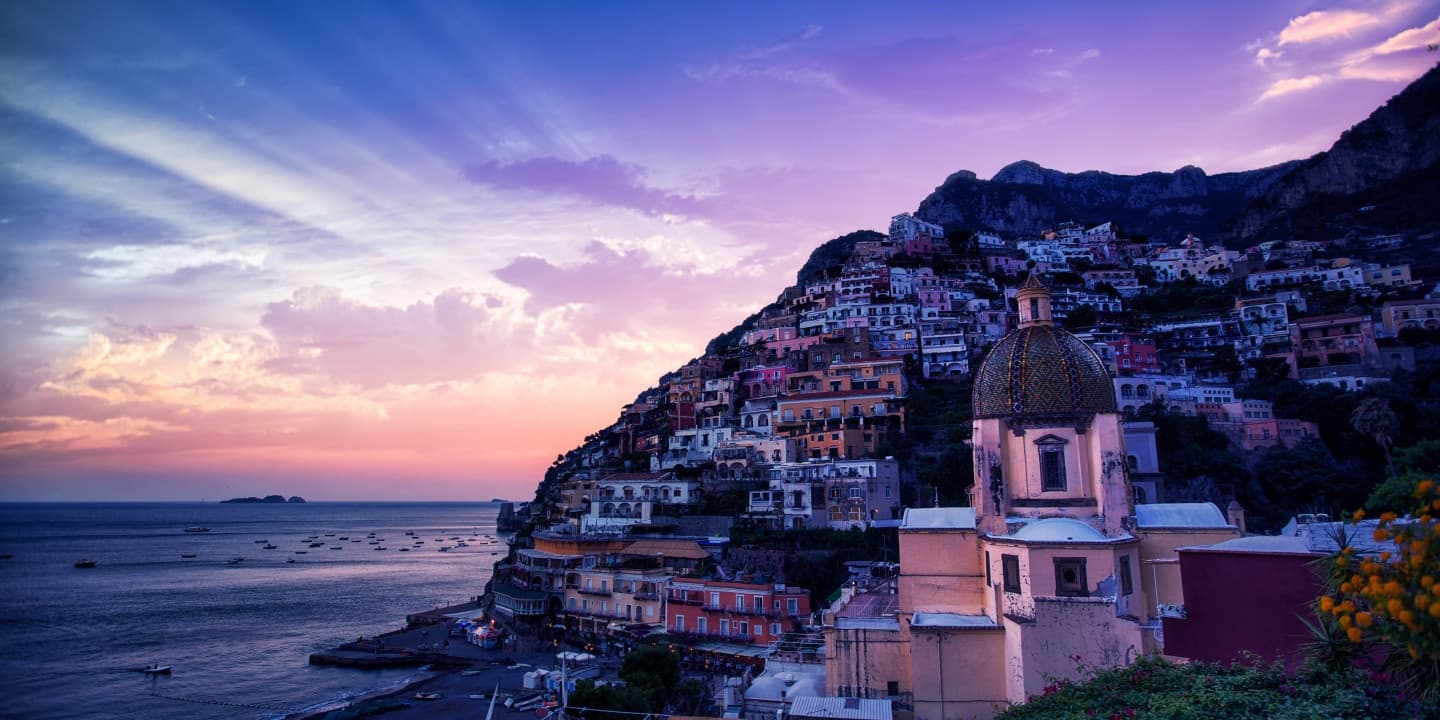 Positano sunset overlooking colorful cliffside town and sea