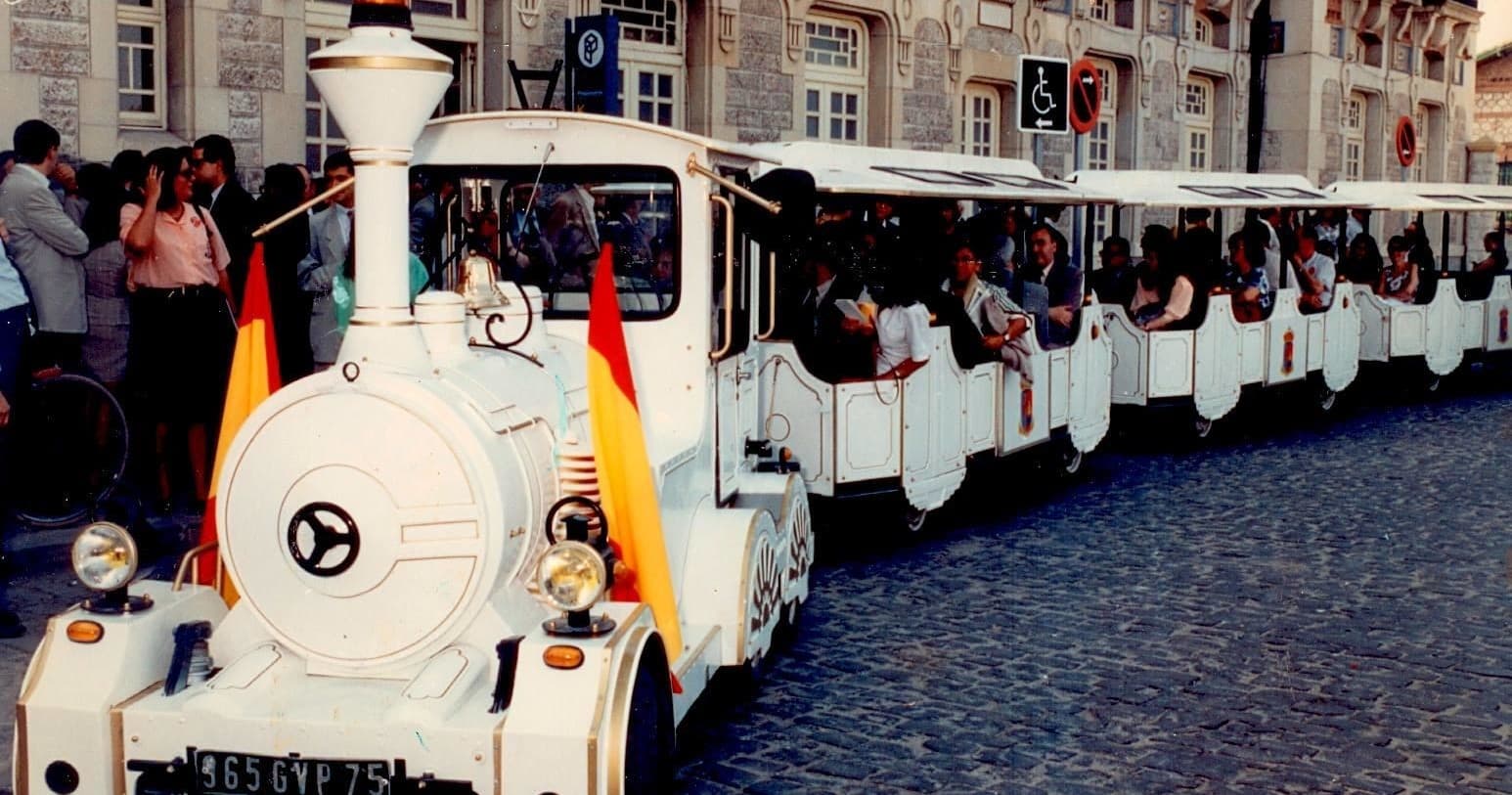 Street tourist train carrying visitors through historic Aranjuez center