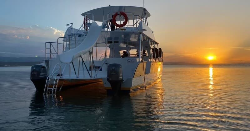 Catamaran sunset cruise off Turks and Caicos with slide