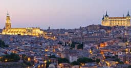 Evening panoramic view of Toledo skyline with illuminated buildings