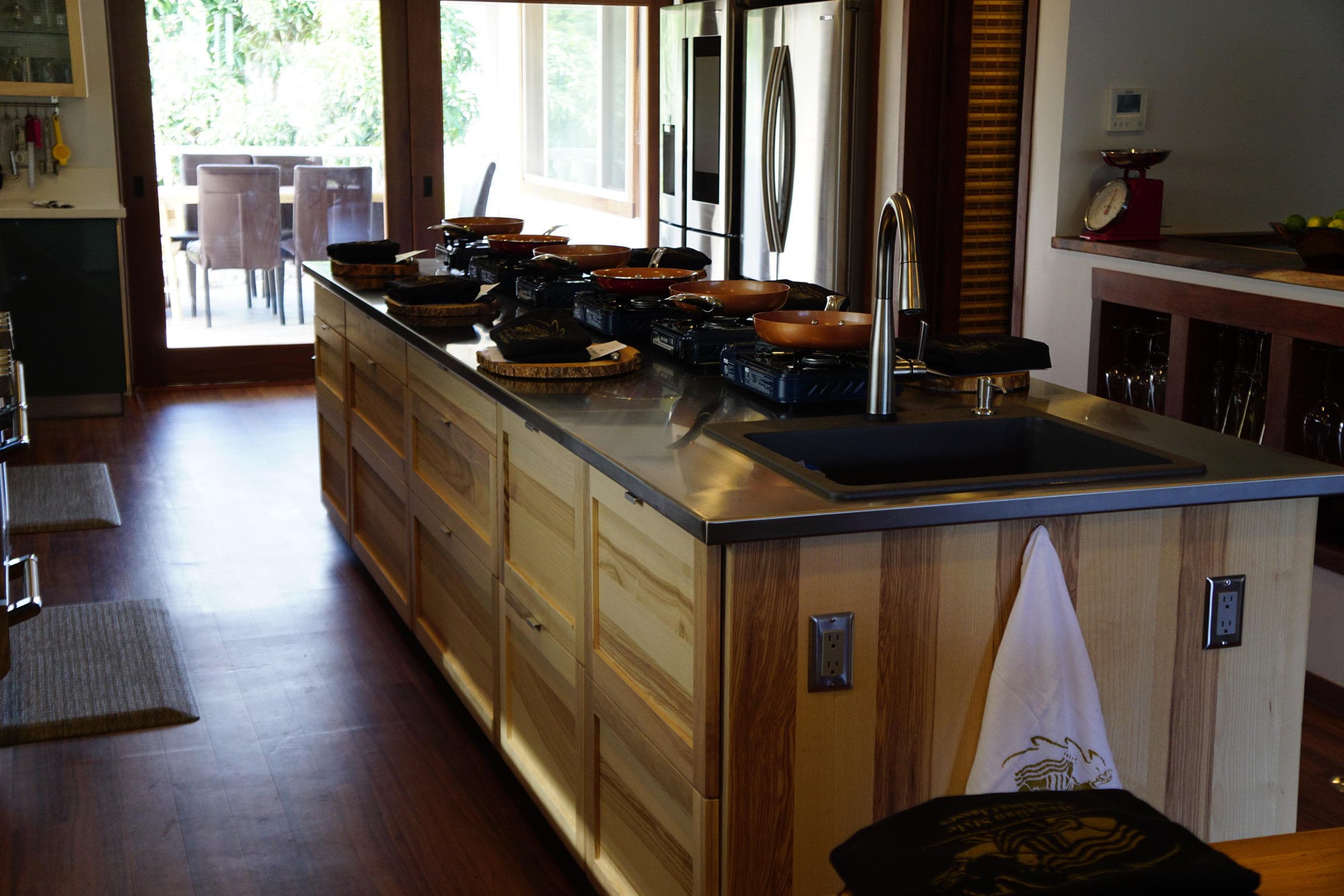 Hawaiian cooking class kitchen island with cookware and ocean light