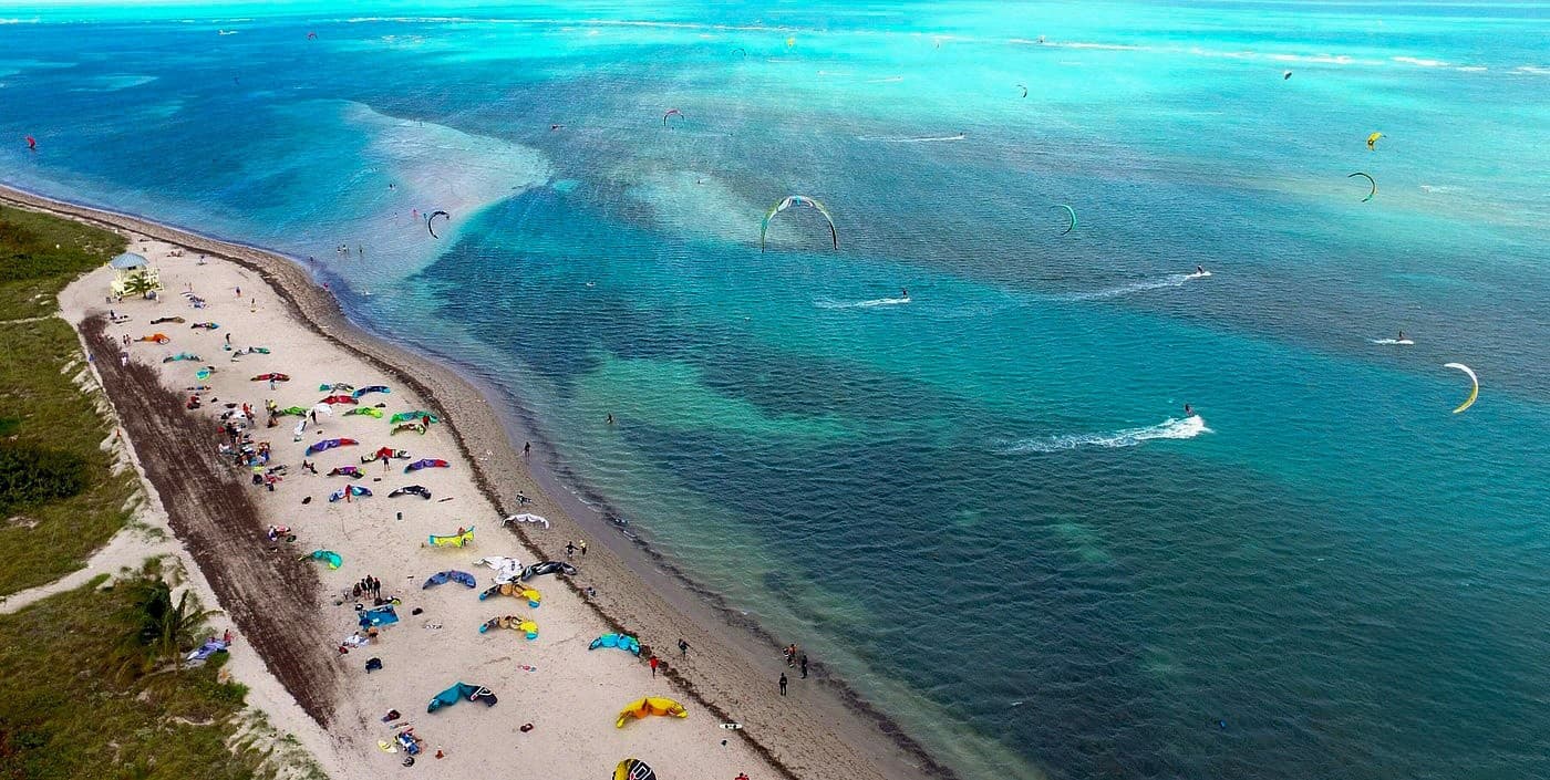 Wide aerial shoreline and clear waters at Crandon Park