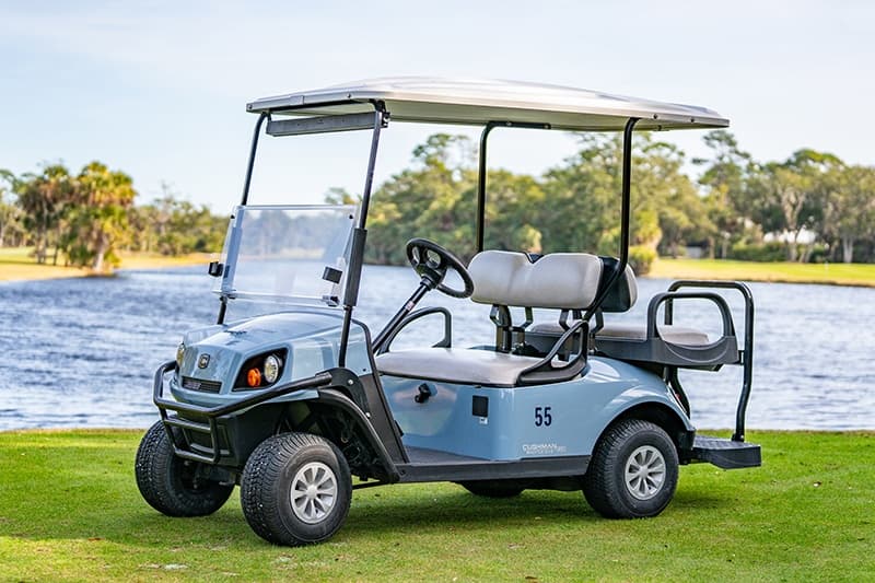 Single golf cart on grassy shore at Fripp Island waterfront