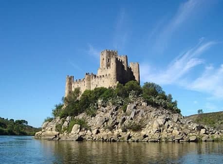 Medieval castle on rocky islet over water, coastal sightseeing