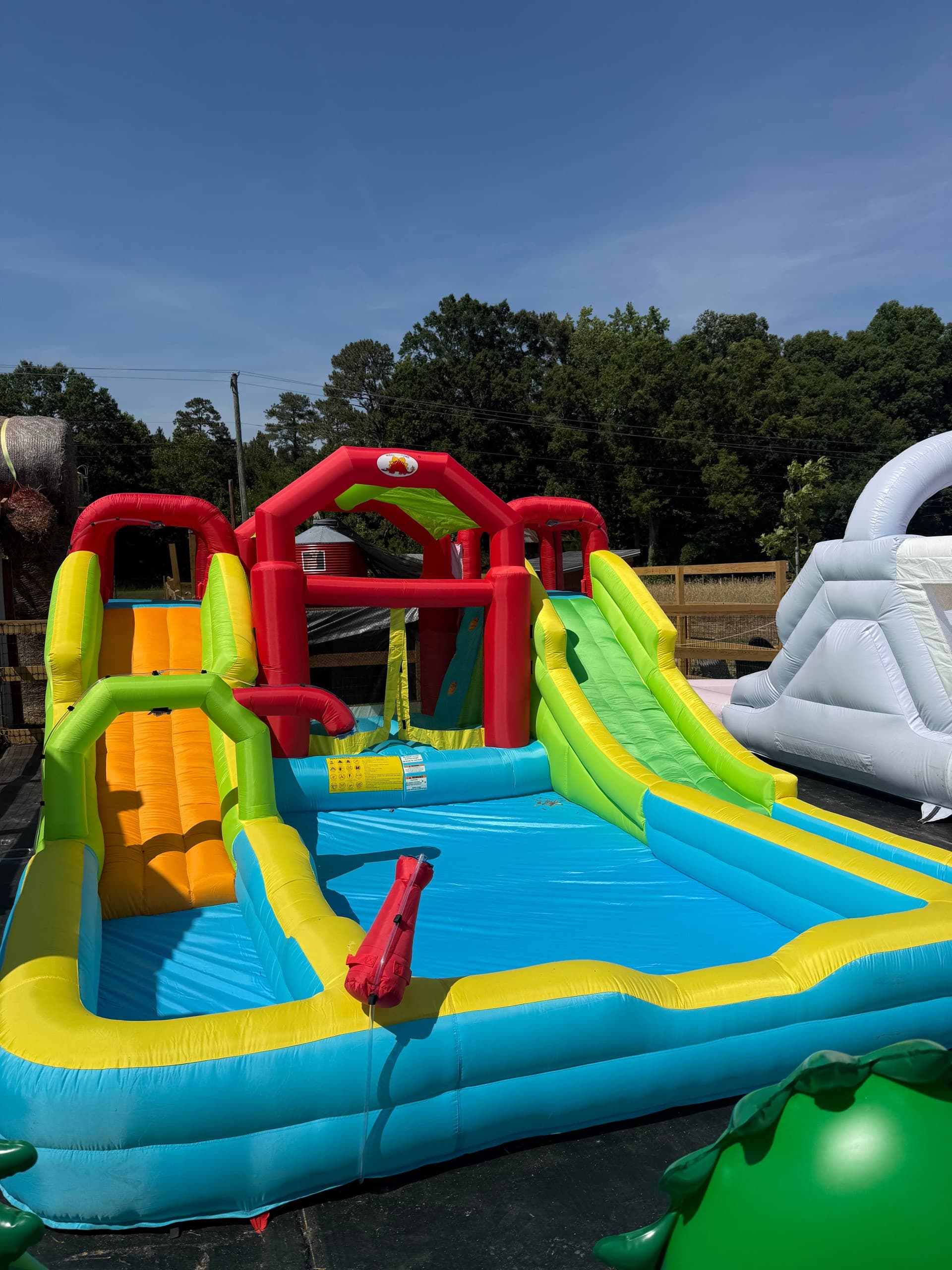 Large inflatable water slide attraction at outdoor fair