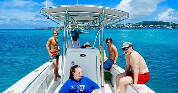 Tour boat cruising clear Caribbean waters with passengers onboard