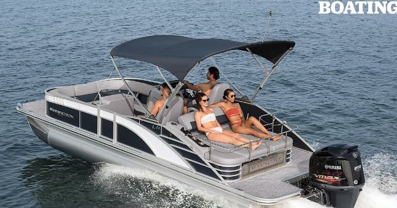 Friends relaxing on pontoon boat with bimini on open water