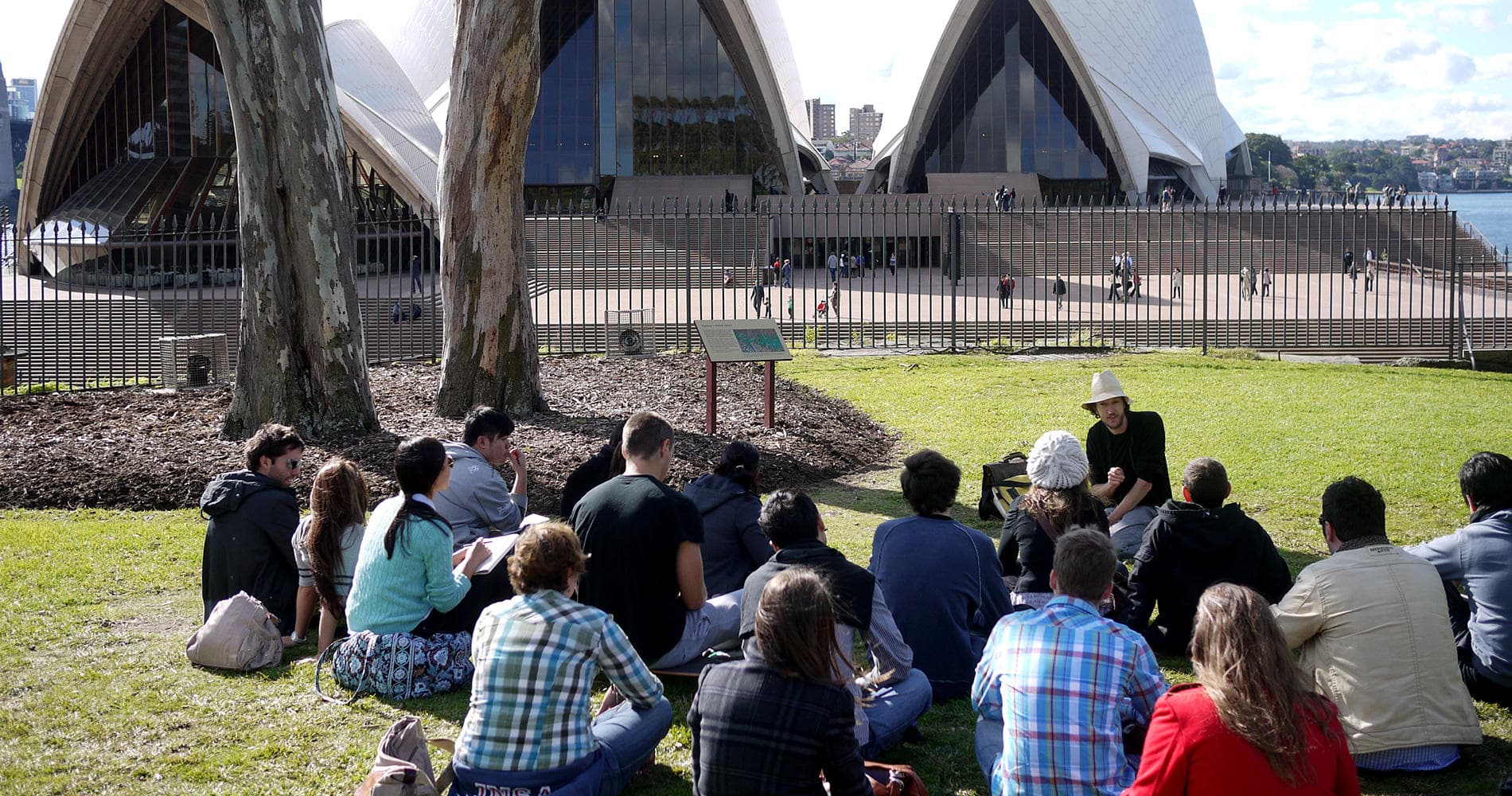 Participants on grass at Sydney Opera House during architecture walk