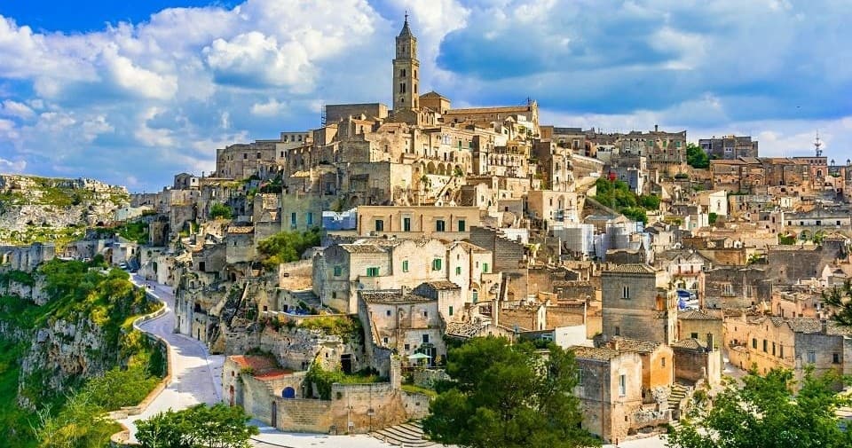 Historic hillside town with stone dwellings and winding paths