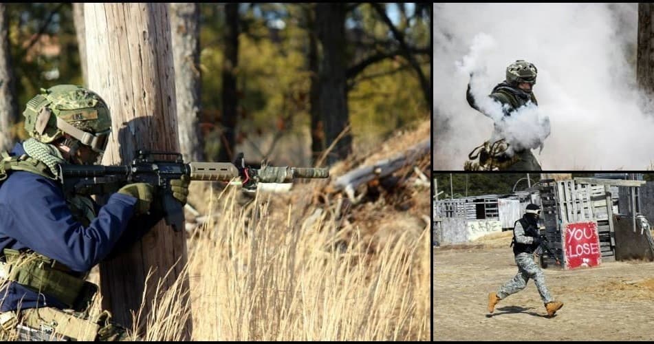 Airsoft players firing behind cover in woodland field skirmish