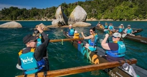 Group waka paddling tour in Abel Tasman coastal waters