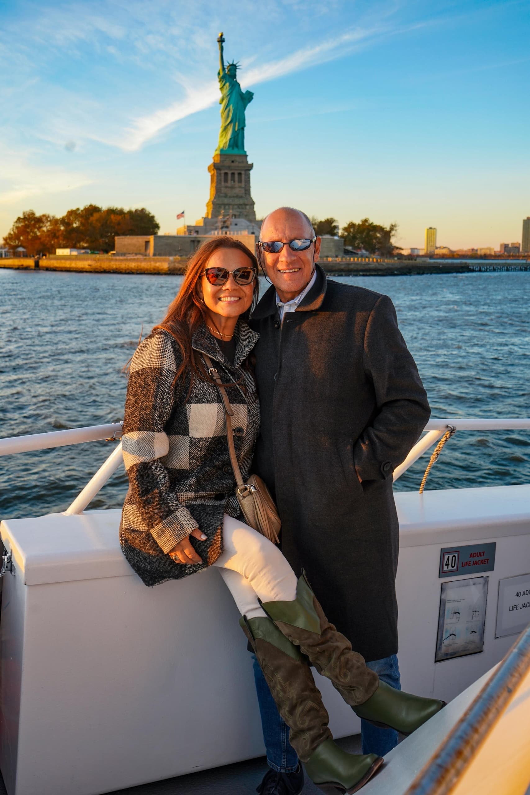 Couple on sightseeing boat near Statue of Liberty harbor cruise