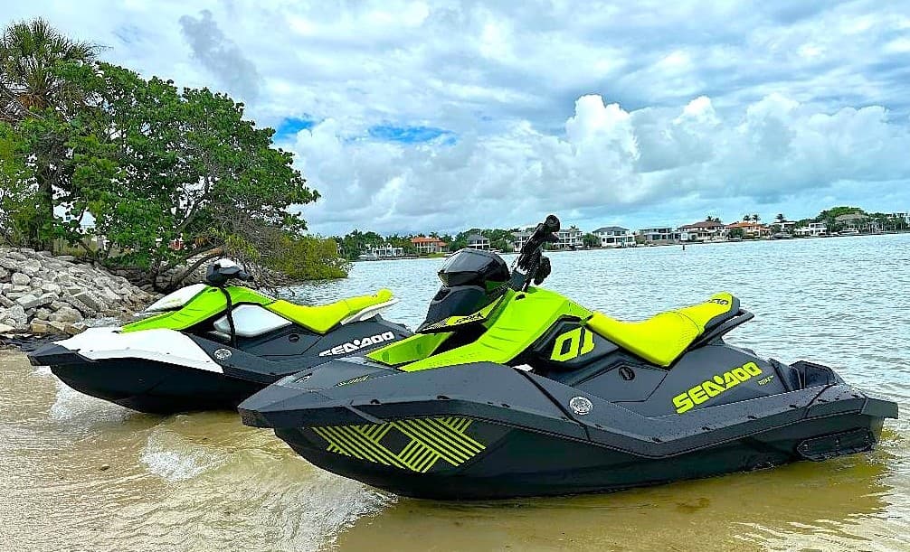 Sea-Doo jet ski rentals on tropical beach ready for ocean riding