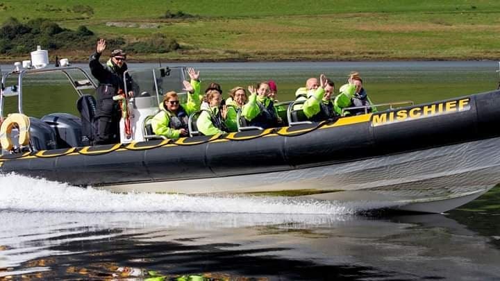 RIB speedboat dolphin-watching tour on coastal waters near Inverness