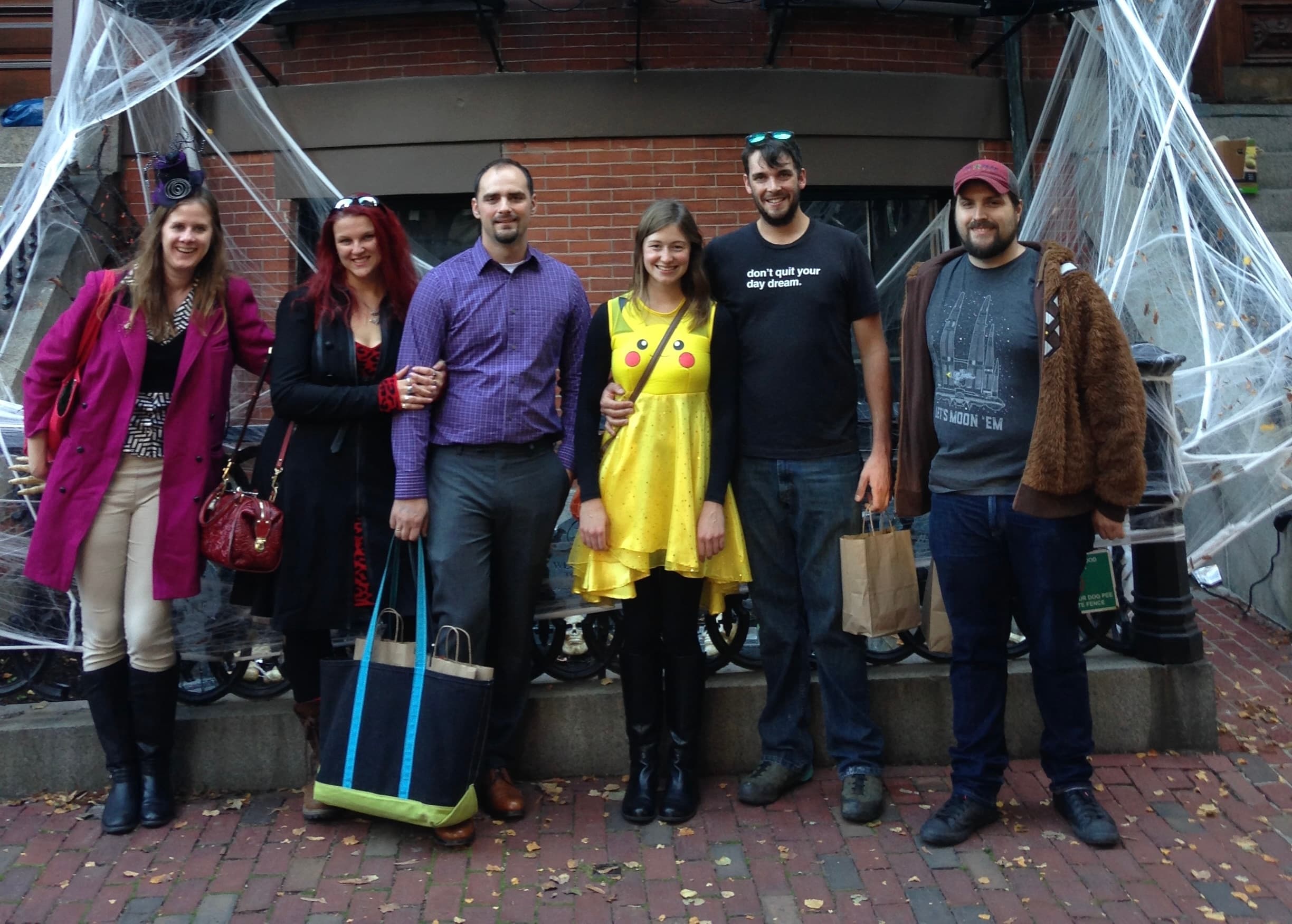 Small group posing outdoors on Cocoa Beantown chocolate tour