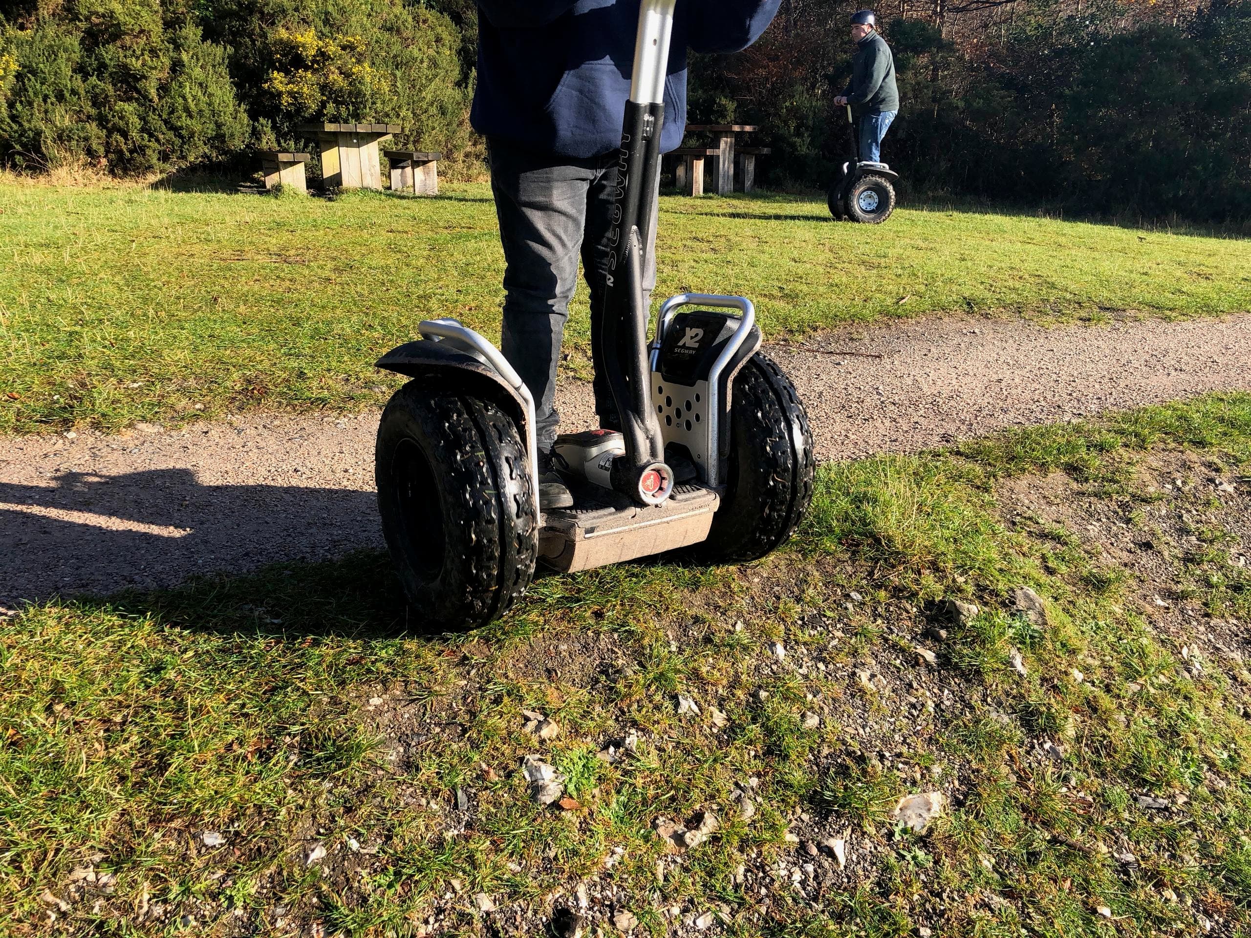 Close-up Segway on grassy trail showcasing off-road ride