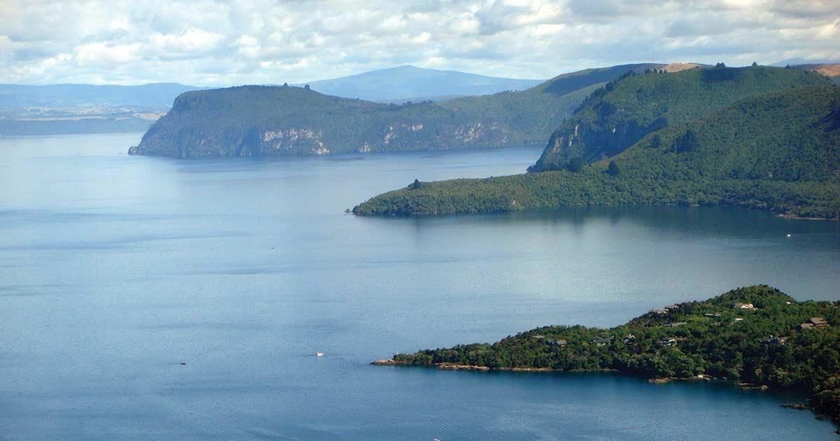 Aerial view of Lake Taupo shoreline and islands, scenic floatplane vista