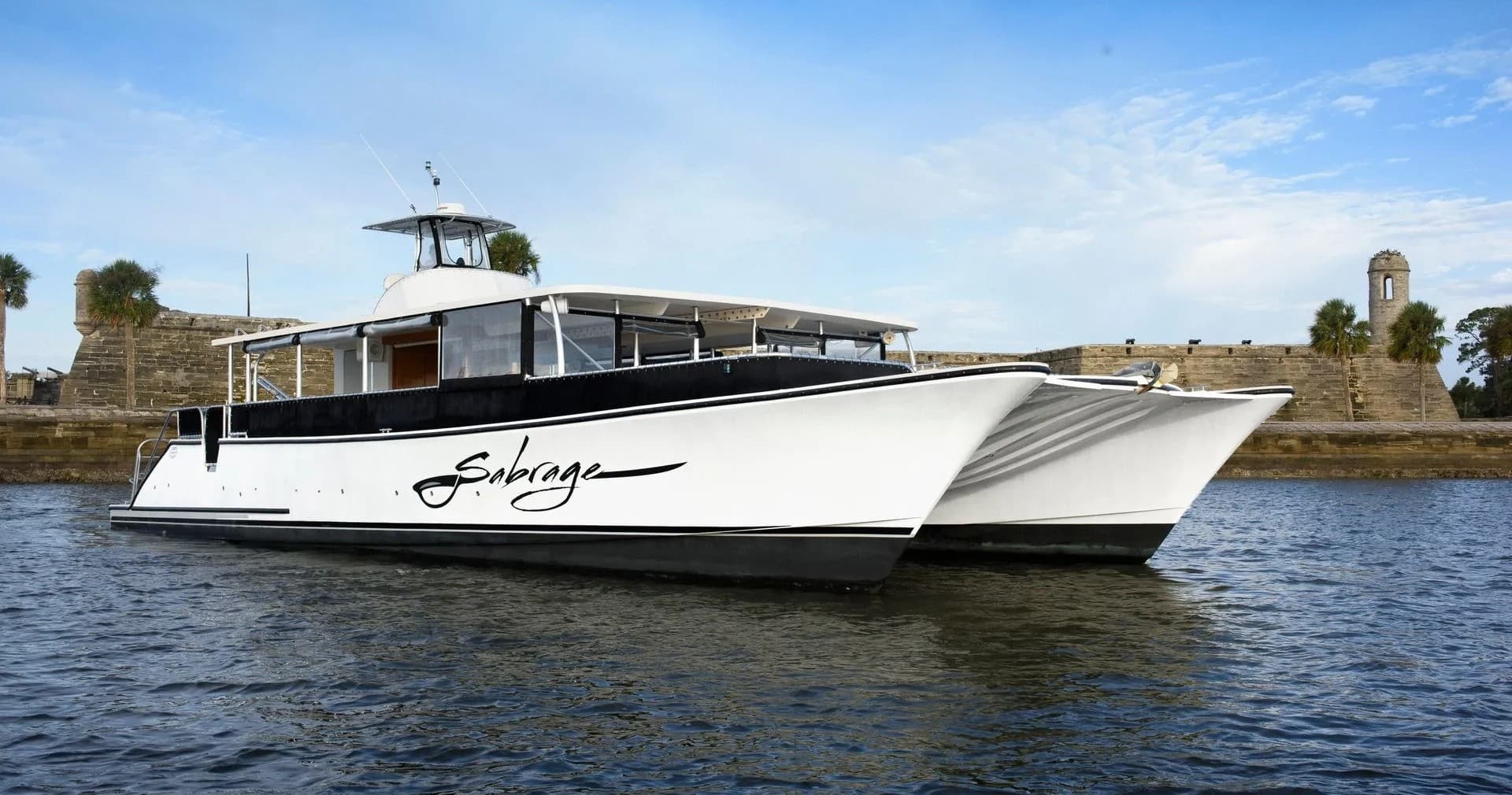 Twin-hull sightseeing boat near historic St. Augustine waterfront